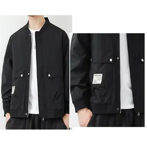 Close-up of black worker jacket with large flap pockets and silver metal buttons
