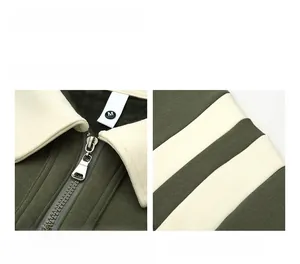 Close-up of olive green waffle knit sweatshirt featuring a white half-zip collar detail