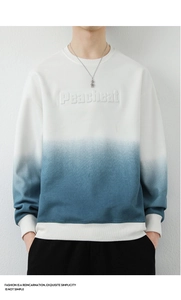 Close-up of Peacheat 3D embossed letters on a gradient blue cotton sweatshirt for men