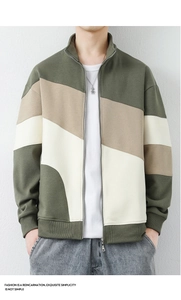 Detail of color-block knit jacket featuring olive green, khaki and cream white panels