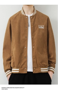 Detail of brown corduroy varsity jacket with ribbed collar and mountain brand patch
