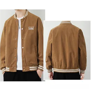 Close-up detail of brown corduroy jacket featuring striped ribbed collar and embroidery