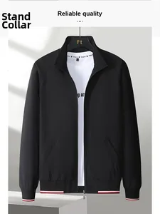 Detail of classic black baseball jacket with red and white striped ribbed cuffs and collar