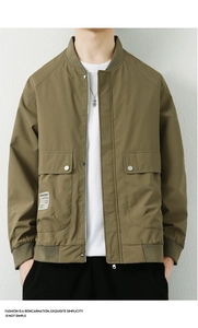 Detail view of olive green bomber jacket with metal zipper and ribbed cuffs for men