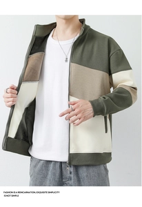 Detail of color-block stand collar jacket with zip closure and ribbed cuffs for men