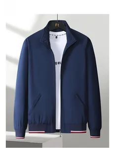 Detail of navy blue fleece jacket with striped ribbed hem and cuffs for men