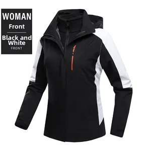Detailed front view of women's black and white waterproof jacket with orange zippers