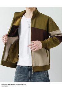 Detail of color-block patchwork cardigan with zip-up stand collar and soft fleece lining