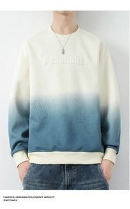 Detail of men's crewneck sweatshirt featuring blue gradient dye and 3D embossed lettering