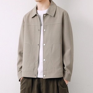 Men's khaki waffle texture jacket featuring classic lapels and silver snap buttons