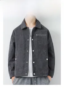 Detail of dark grey corduroy jacket for men featuring metallic zipper pocket and lapel
