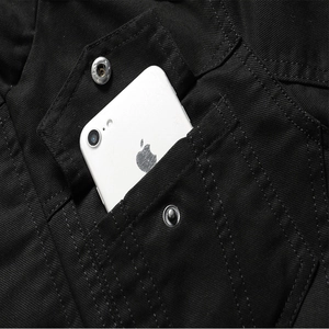 Men's black cotton workwear jacket featuring a deep flap pocket with silver metal button