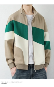 Detail of color-block jacket with stand collar ribbed cuffs and zipper closure for men