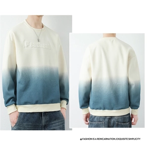 Close-up of the 3D embossed lettering on a cotton gradient crewneck sweatshirt