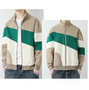 Detail of color-block standing collar zip jacket with khaki, green and white panels