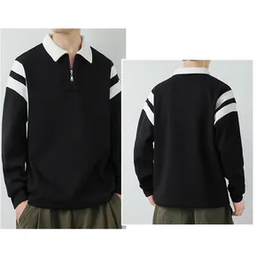 Detail of men's polo sweatshirt featuring contrast collar and metal zipper with arm stripes