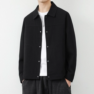 Men's minimalist black waffle texture jacket with classic lapel and snap button closure
