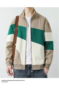 Detail of men's stand-collar jacket with khaki and green color-block patchwork design