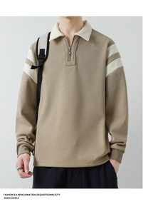 Detail of khaki men's quarter-zip polo shirt featuring contrast collar and white stripes