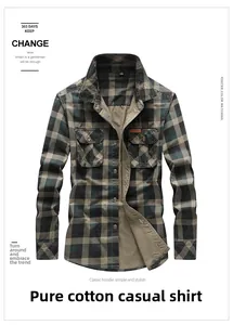 Detail of classic plaid cotton shirt featuring symmetrical flap pockets and thick texture