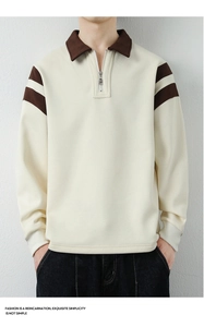 Detail of men's half-zip sweatshirt with brown polo collar and striped sleeves