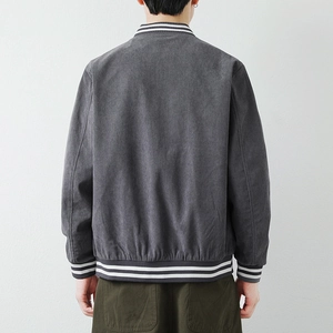 Back view of men's dark gray corduroy bomber jacket with striped rib-knit cuffs