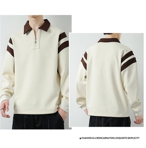 Detail of men's polo sweatshirt with half-zip collar and retro striped sleeve design