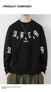 Detail of gothic white letter printing on a black crewneck sweatshirt for men