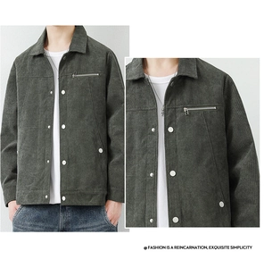 Detail shot of green corduroy jacket texture featuring metal buttons and zipper chest pocket
