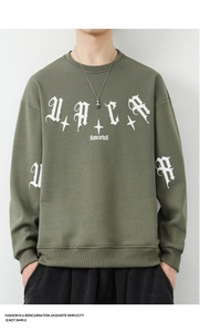 Detailed front view of olive green crewneck sweatshirt with gothic white letter printing