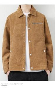 Detail of brown corduroy jacket featuring classic collar and silver metal button closure