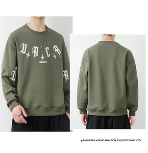 Detail of army green crewneck sweatshirt with gothic white letter print and ribbed cuffs