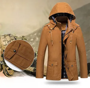 Detail of khaki men's hooded jacket featuring blue plaid lining and large flap pockets
