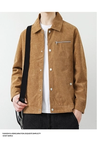 Close-up of brown corduroy jacket texture with lapel collar and silver zipper chest pocket