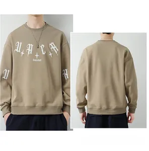 Front and back view of khaki crewneck sweatshirt with white gothic graphic print