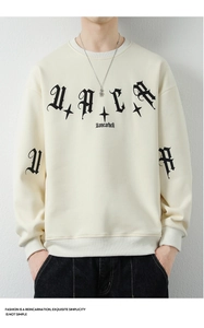 Detailed close-up of heavyweight cream cotton sweatshirt with black gothic typography