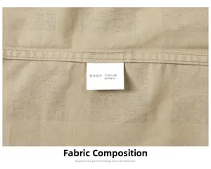 Close-up of cotton fabric texture and laundry care label showing 100% cotton composition