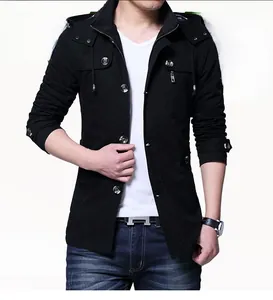 Detail of men's black hooded jacket with metal buttons and vertical zip chest pocket