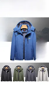 Detail of waterproof fleece jacket with detachable hood and zip pockets for skiing