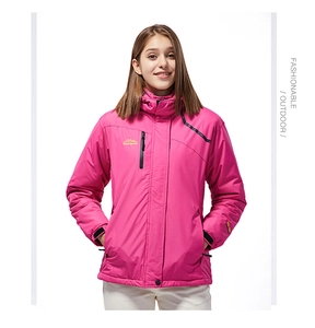 Detail of rose pink waterproof ski jacket with hooded collar and yellow mountain logo