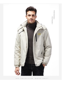 Detail of the hooded outdoor jacket with mountain logo on chest and windproof collar