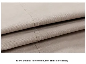 Detailed macro view of khaki pure cotton twill fabric showing neat stitching and soft texture