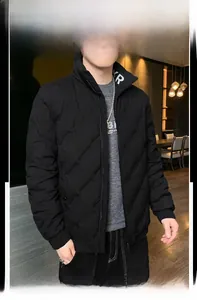 Close-up of men black quilted down jacket with stand collar and inner printed t-shirt