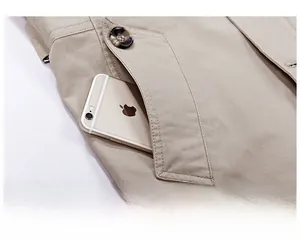Macro detail of men's beige cargo jacket pocket with twill cotton fabric and button