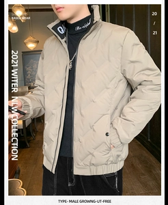 Detail of light khaki quilted down jacket with a stand collar and ribbed hem design