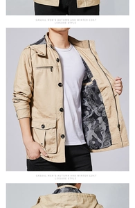 Detail of khaki cotton jacket showing camo lining, drawstring hood, and multi-pockets