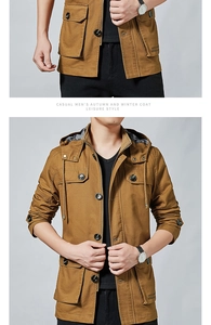 Detail of camel cotton utility jacket featuring four large cargo pockets and stand collar