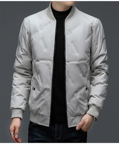 Detailed close-up of light grey quilted jacket with rib-knit stand-up collar design