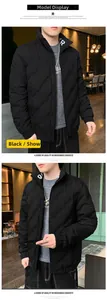 Detailed view of the wave quilting and white KR letter logo on the collar of a black jacket