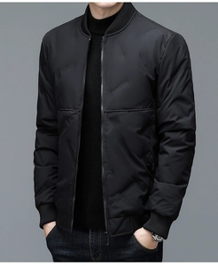 Close-up of black quilted bomber jacket featuring ribbed collar and metallic zipper detail